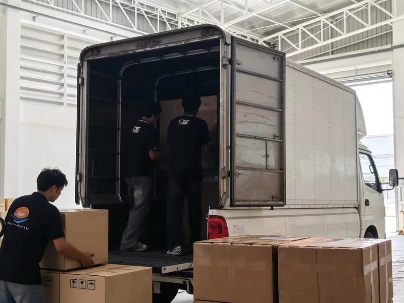 DTS team loading boxed orders into a delivery truck